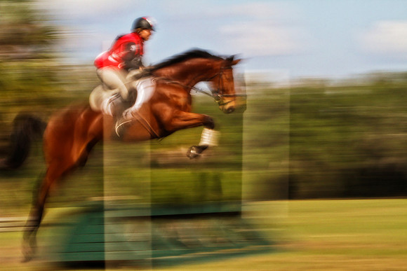 rider with red vest over jump se
