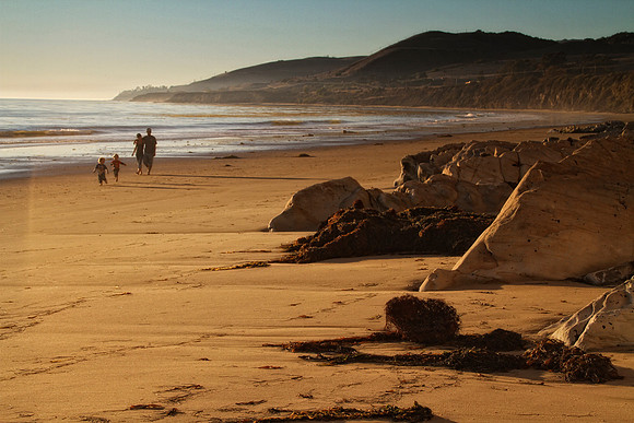 couple with kids on beach